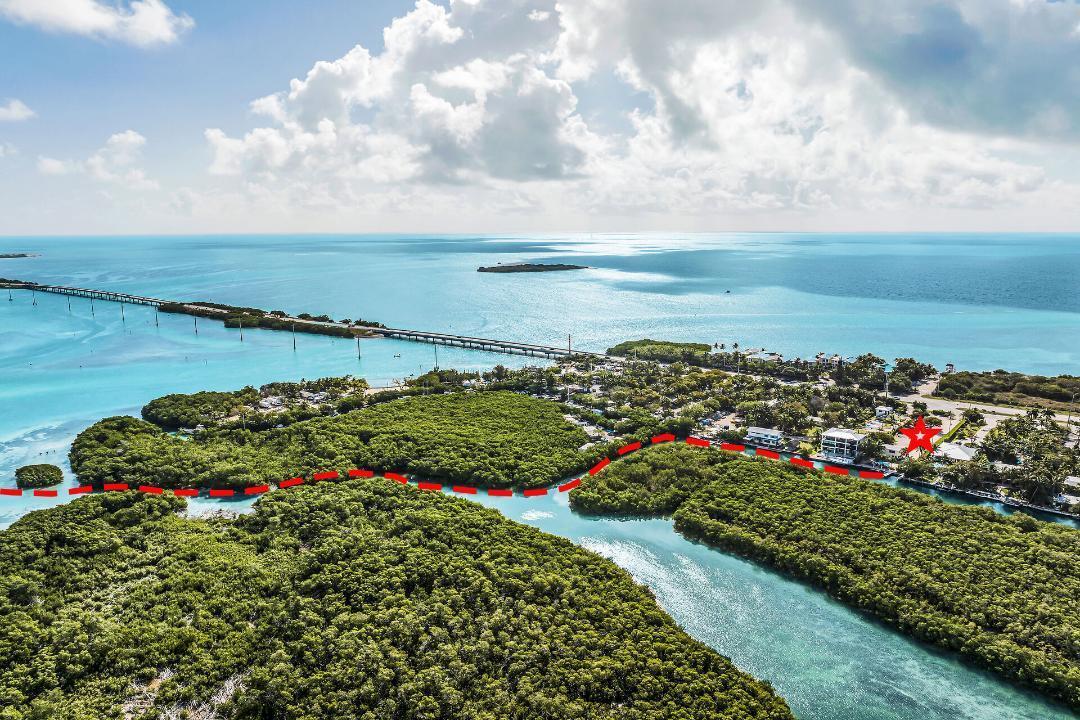An aerial view shows a coastal property with a red star and boundary line markings — 77340 Overseas Highway, Islamorada FL 33036, ISLAMORADA, FL