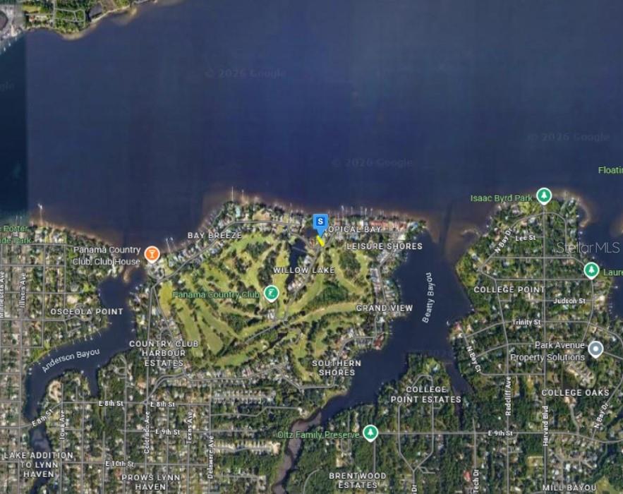 This is an aerial map showing residential neighborhoods, a golf course, and waterways in Lynn Haven — 1990 COUNTRY CLUB DRIVE, LYNN HAVEN, FL