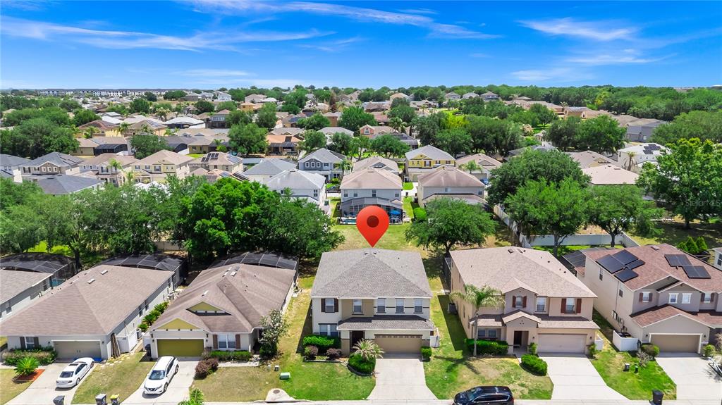 An aerial view shows a two-story suburban house with a red location pin on top — 200 ANDOVER DRIVE, DAVENPORT, FL