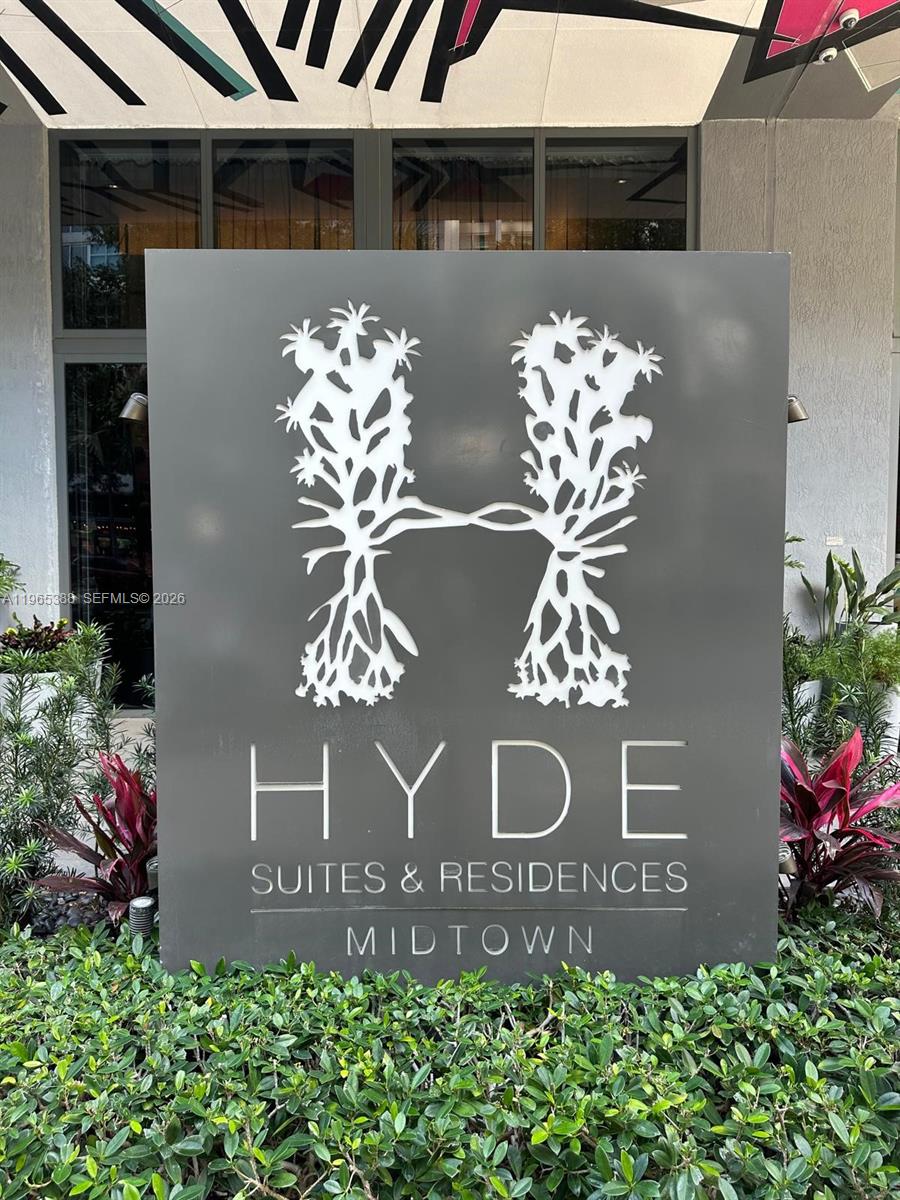 A gray sign for Hyde Suites & Residences Midtown stands in front of a building — 121 NE 34th St # 1505, Miami FL 33137, MIAMI, FL