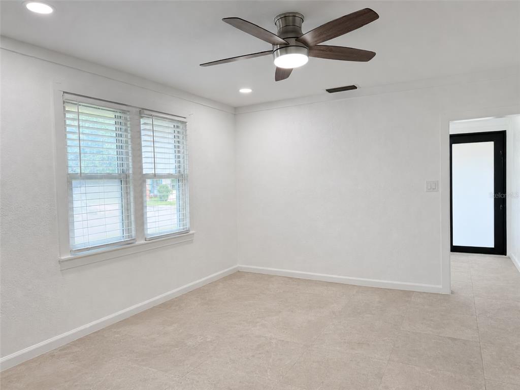 A bright room with white walls, tile flooring, a ceiling fan, and a window — 111 PAGE STREET, ORLANDO, FL