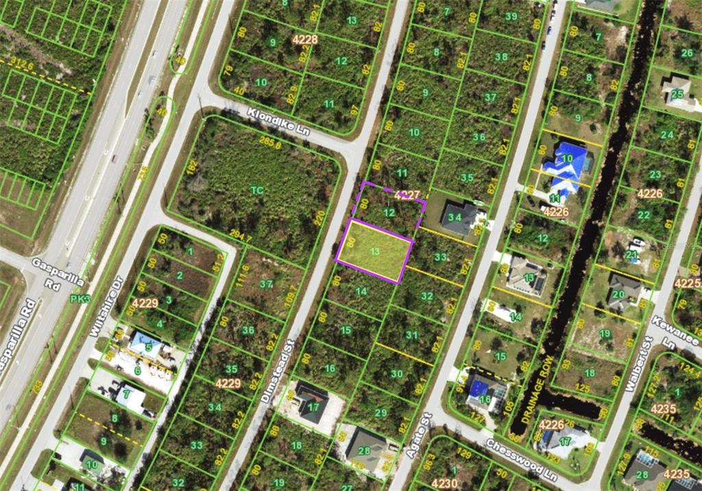 This is an aerial map showing a highlighted vacant lot in a residential neighborhood — 8226 DIMSTEAD STREET, PORT CHARLOTTE, FL