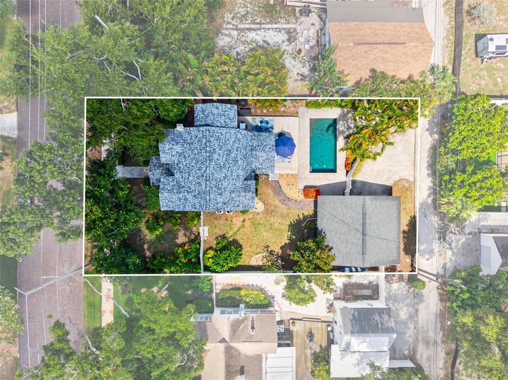 An aerial view shows a house with a swimming pool and a detached garage — 775 28TH AVENUE N, ST PETERSBURG, FL