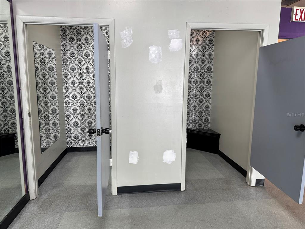 Two dressing rooms with black and white damask wallpaper and grey doors — 14815 N FLORIDA AVENUE UNIT 14815, TAMPA, FL