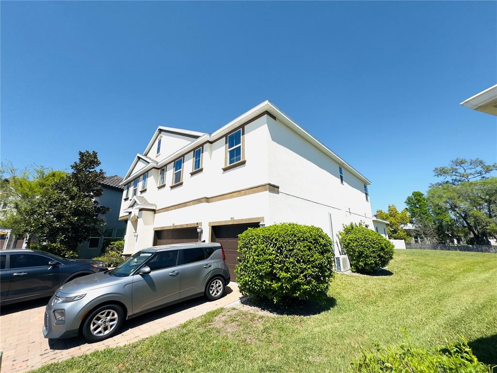 A two-story house with a two-car garage and a silver SUV parked in the driveway — 3436 STONEWYCK STREET, ORLANDO, FL