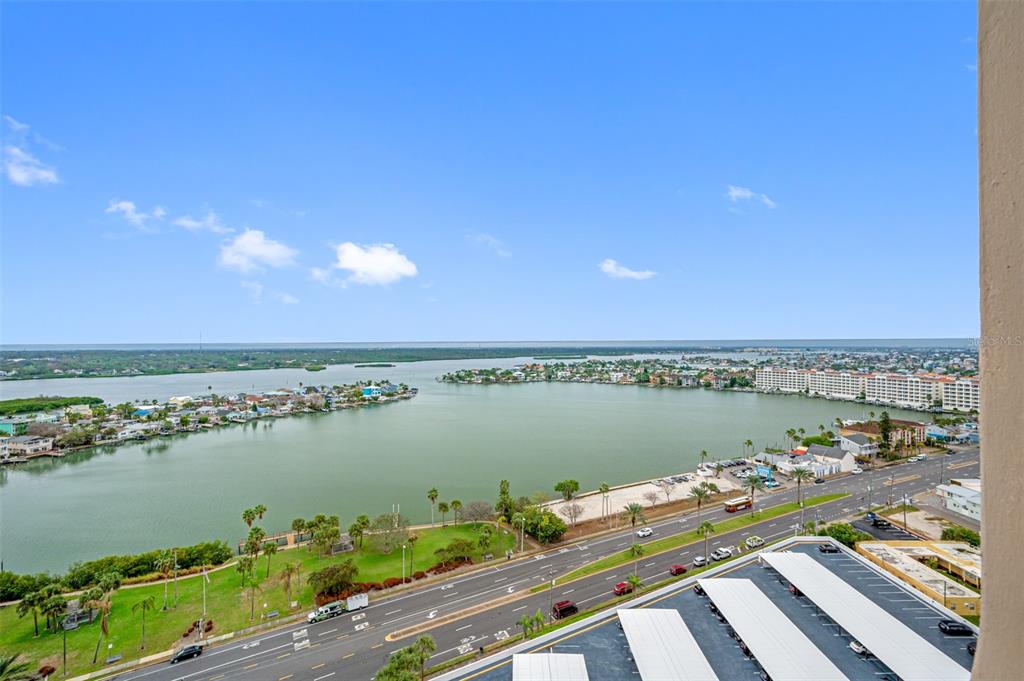 An elevated view of a coastal bay, a multi-lane road, and a large apartment complex — 17920 GULF BOULEVARD UNIT 2008, REDINGTON SHORES, FL