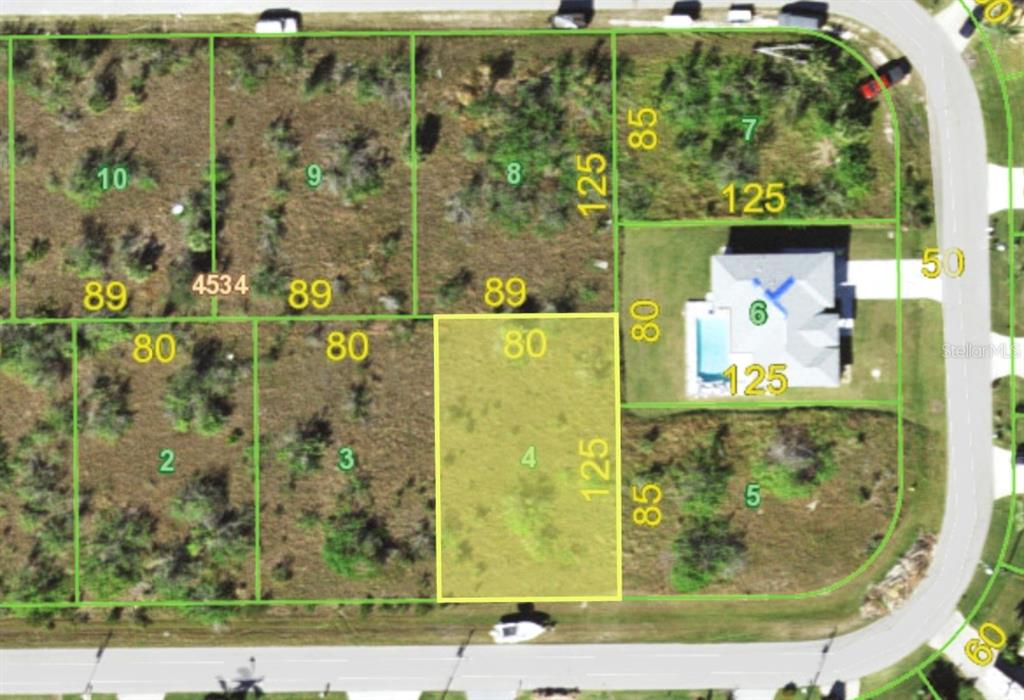 This is a property map showing a highlighted rectangular lot among several adjacent parcels — 15523 MCCOMB CIRCLE, PORT CHARLOTTE, FL