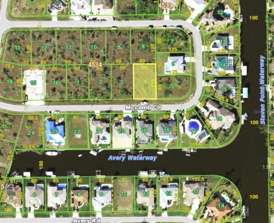 This is a map showing residential lots and waterways in a suburban neighborhood — 15523 MCCOMB CIRCLE, PORT CHARLOTTE, FL