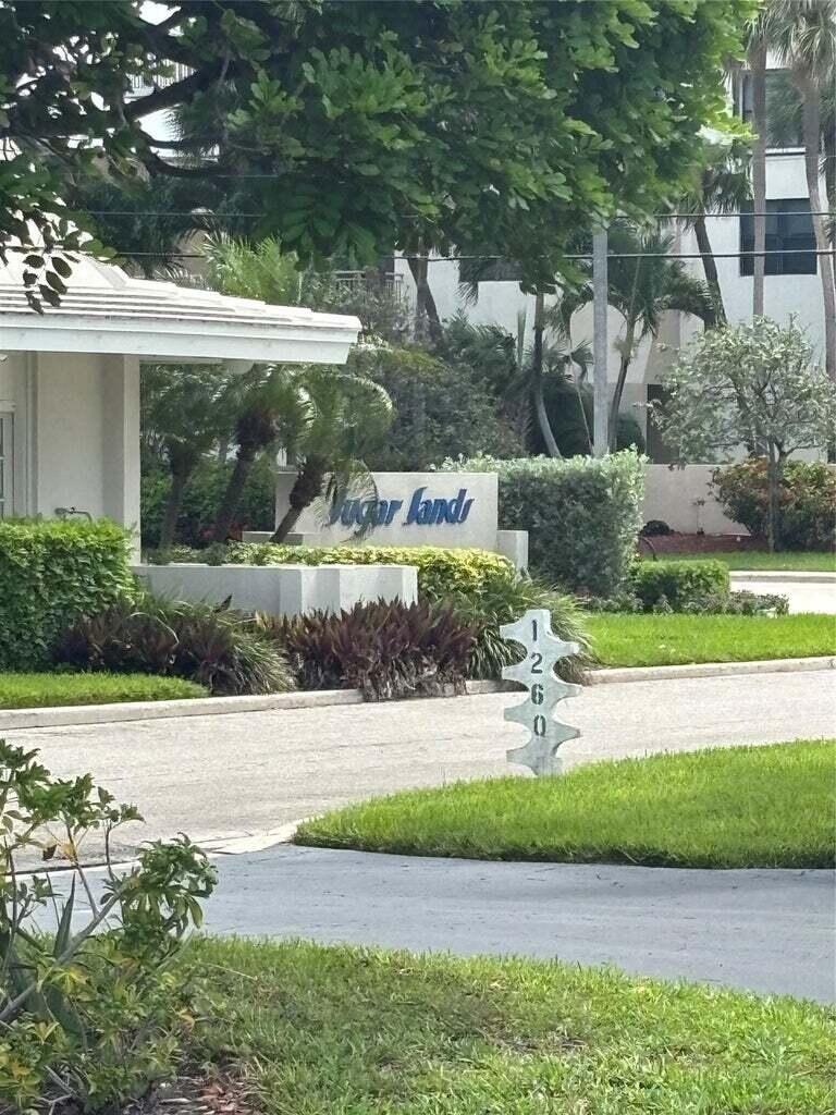 The entrance to the Sugar Sands community features a sign and a vertical address marker — 1260 Sugar Sands Boulevard # 206, Singer Island FL 33404, SINGER ISLAND, FL