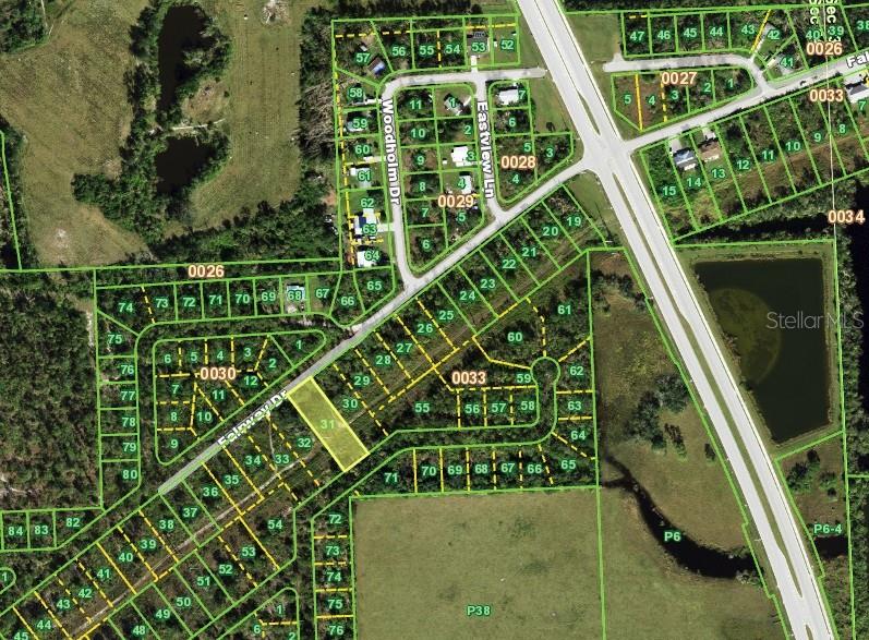 This is an aerial map showing residential lots and streets in a suburban neighborhood — 26430 PEACHLAND LANE, PUNTA GORDA, FL