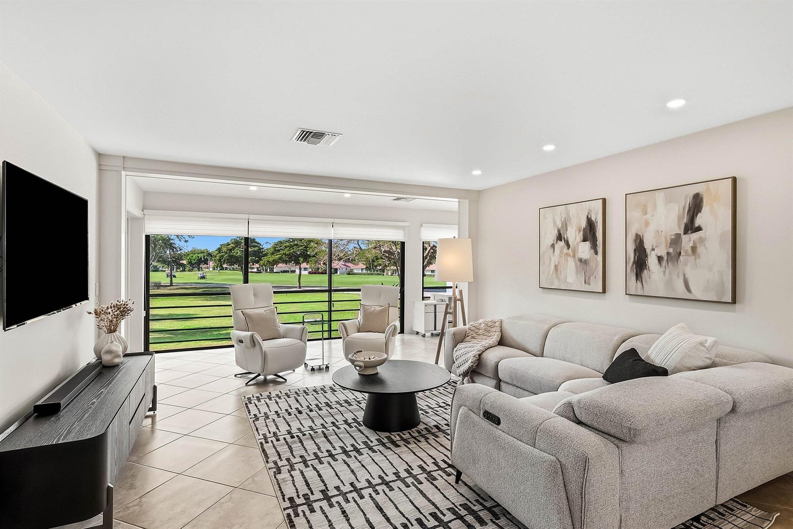 A living room features a sectional sofa, two armchairs, a coffee table, and golf course views — 4114 B Quail Ridge Drive N, Boynton Beach FL 33436, BOYNTON BEACH, FL