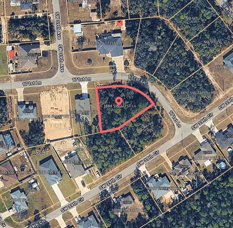 This is an aerial map showing a vacant, wooded residential lot outlined in red — 3884 SW 171ST LANE, OCALA, FL