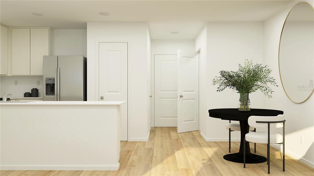 This is a digital rendering of a kitchen and dining area with light wood flooring — 3048 CAPTAIN JAX WAY, WINTER HAVEN, FL