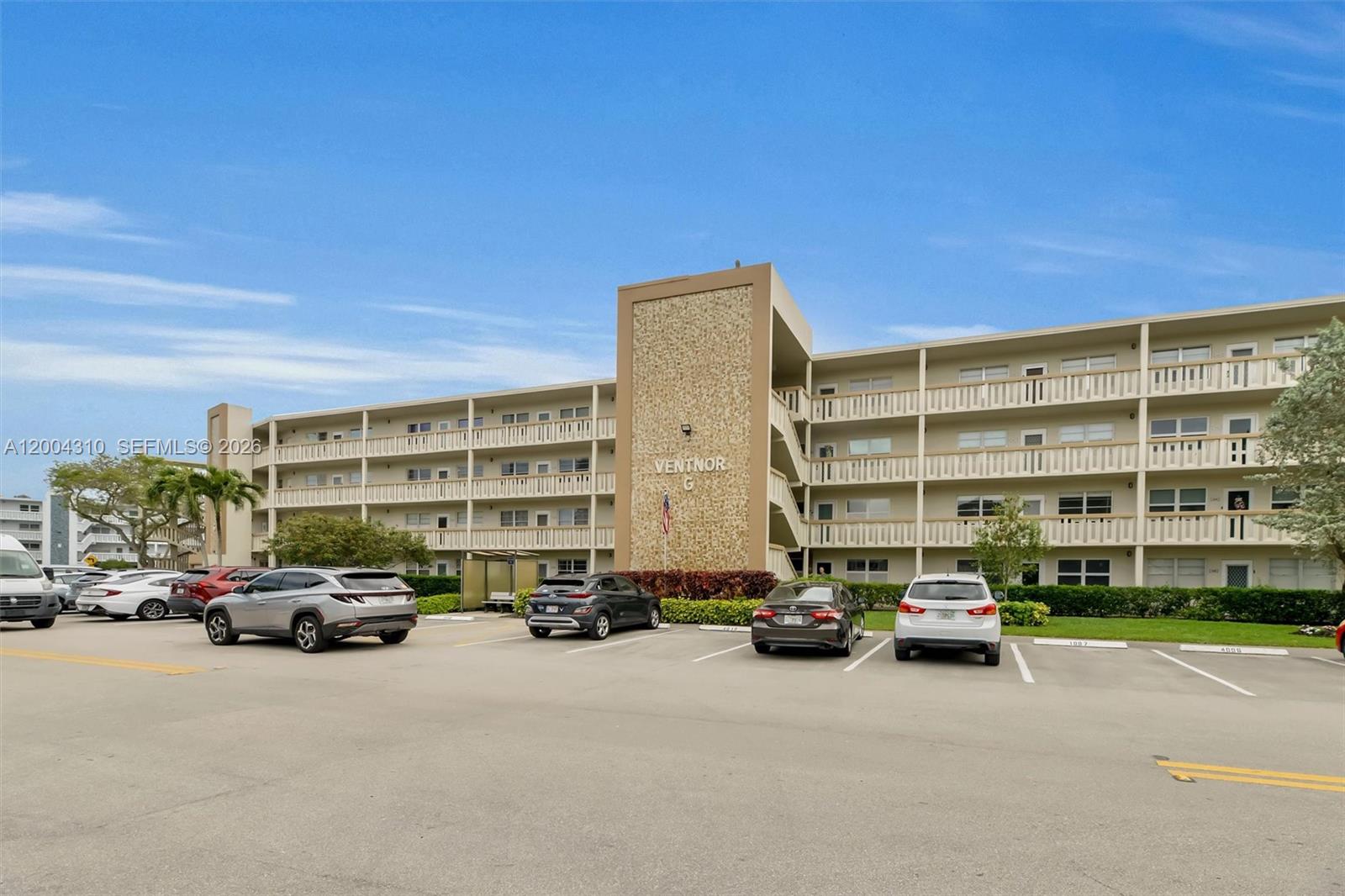 A multi-story apartment building with a parking lot in the foreground — 3013 Ventnor G # 3, Deerfield Beach FL 33442, DEERFIELD BEACH, FL