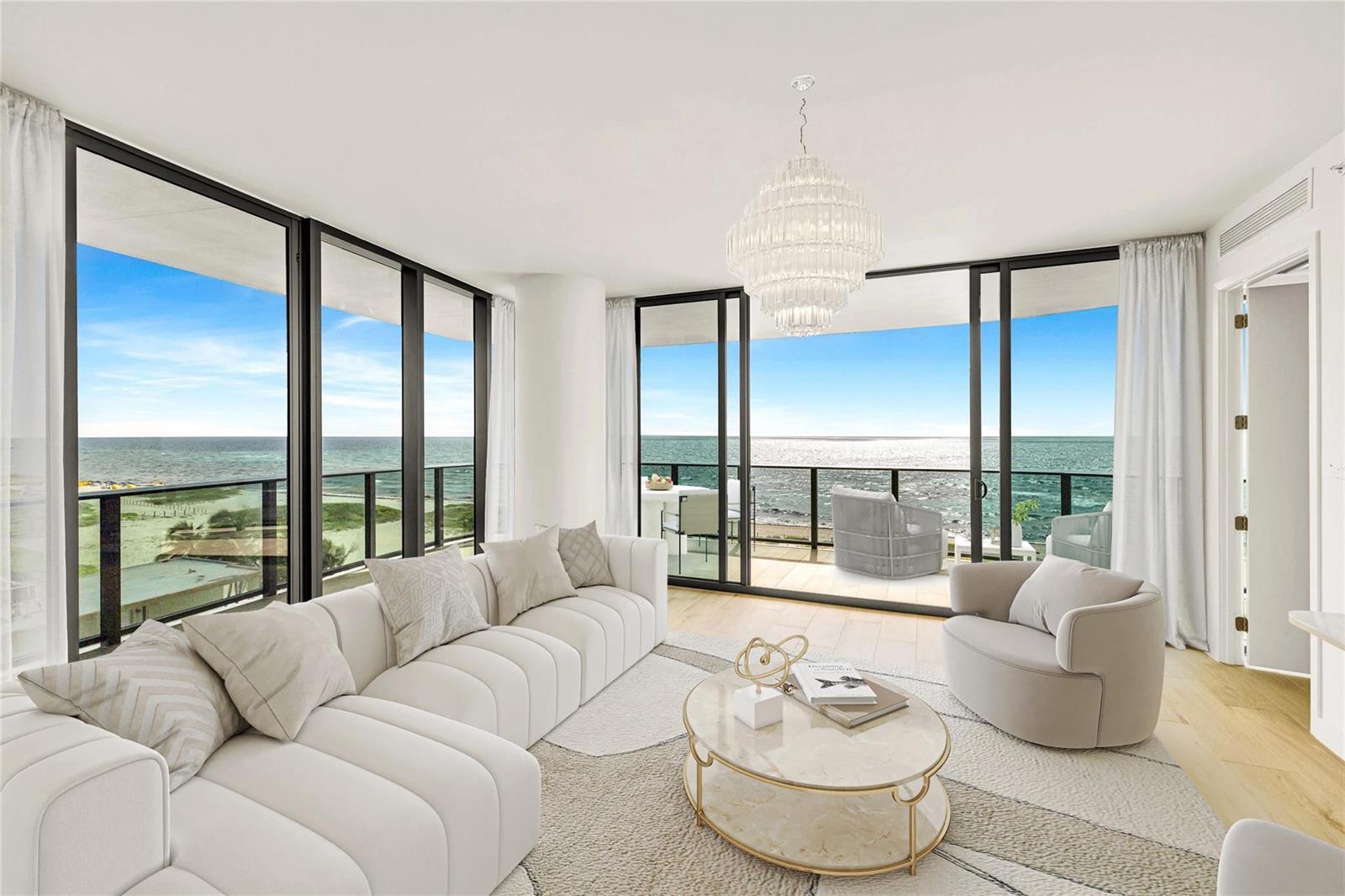 A bright living room features a white sectional sofa, a marble coffee table, and ocean views — 900 N Ocean Boulevard # 606, Pompano Beach FL 33062, POMPANO BEACH, FL