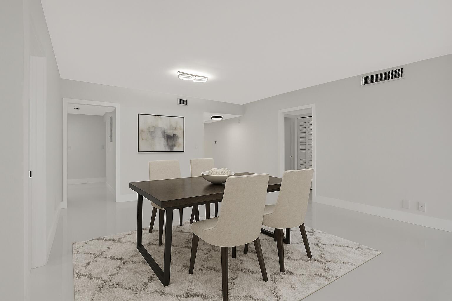 A dining room features a dark wood table, four upholstered chairs, and a patterned area rug — 3505 Oaks Way # 204, Pompano Beach FL 33069, POMPANO BEACH, FL