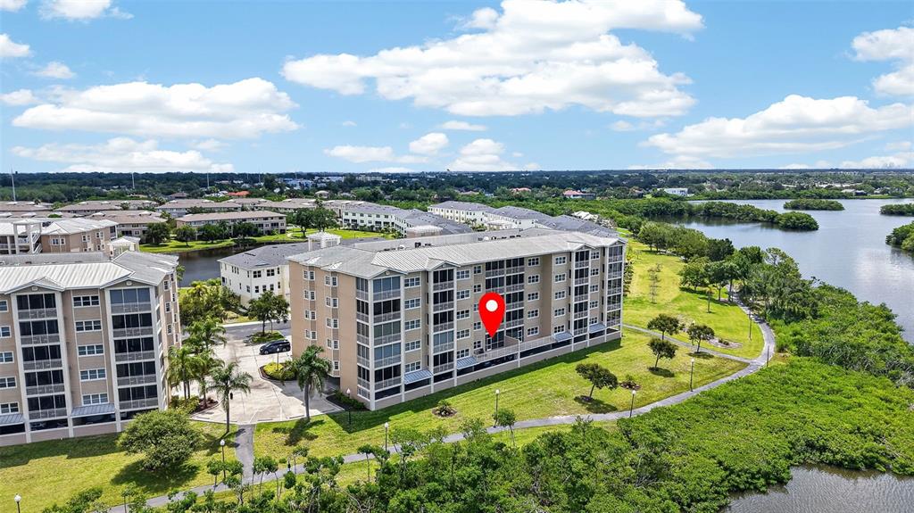 An aerial view shows a multi-story apartment building with a red location pin — 10002 KEY HAVEN ROAD UNIT 204, SEMINOLE, FL
