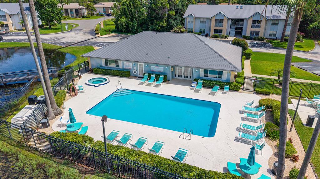 An aerial view of a swimming pool and hot tub at an apartment complex — 101 BENT TREE DRIVE UNIT 15, DAYTONA BEACH, FL