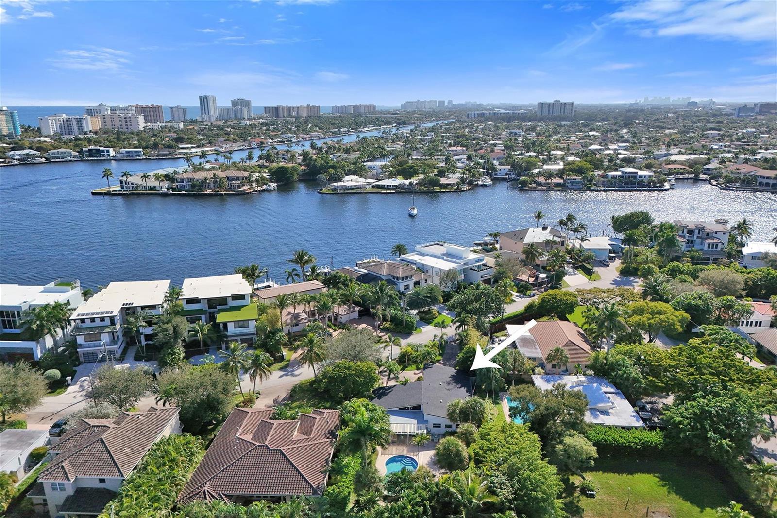 An aerial view shows a residential neighborhood with waterfront homes, swimming pools, and lush landscaping — 2525 SE 7th Drive, Pompano Beach FL 33062, POMPANO BEACH, FL