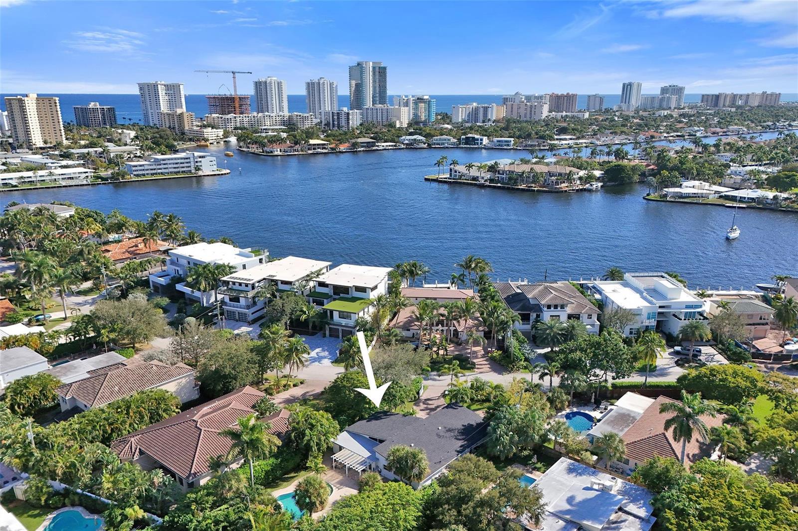 An aerial view shows a residential neighborhood with a house highlighted by a white arrow — 2525 SE 7th Drive, Pompano Beach FL 33062, POMPANO BEACH, FL