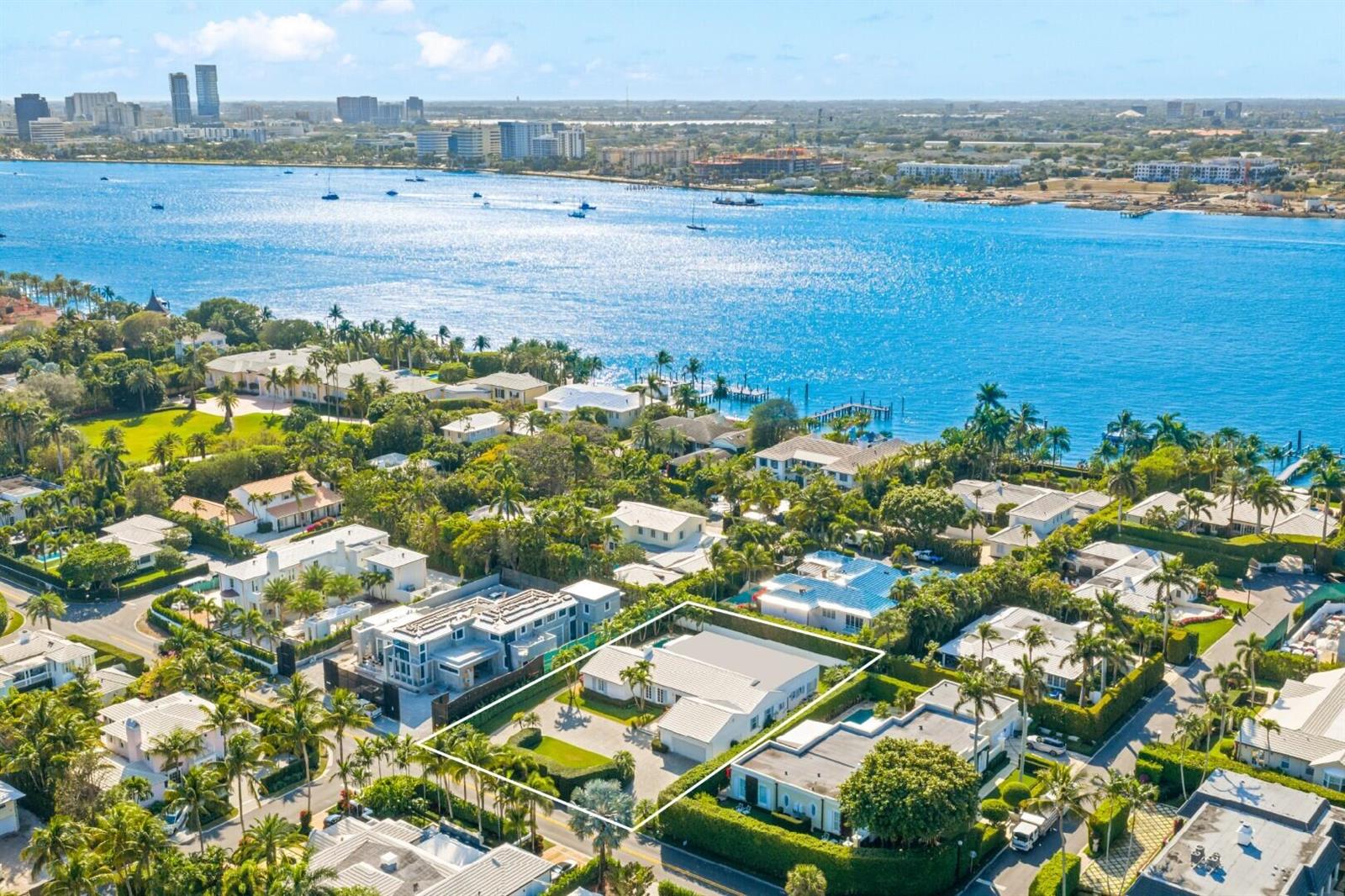 An aerial view of a single-story house with a pool, surrounded by lush tropical landscaping — 624 N Lake Way, Palm Beach FL 33480, PALM BEACH, FL