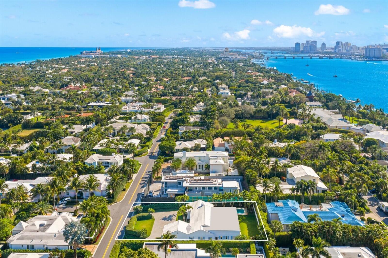 An aerial view shows a white house with a metal roof and a swimming pool — 624 N Lake Way, Palm Beach FL 33480, PALM BEACH, FL