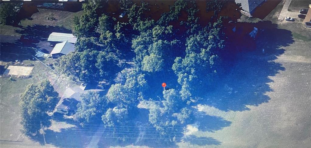 An aerial view shows a wooded residential lot marked with a red pin — TBD SE SUNSET HARBOR ROAD, SUMMERFIELD, FL