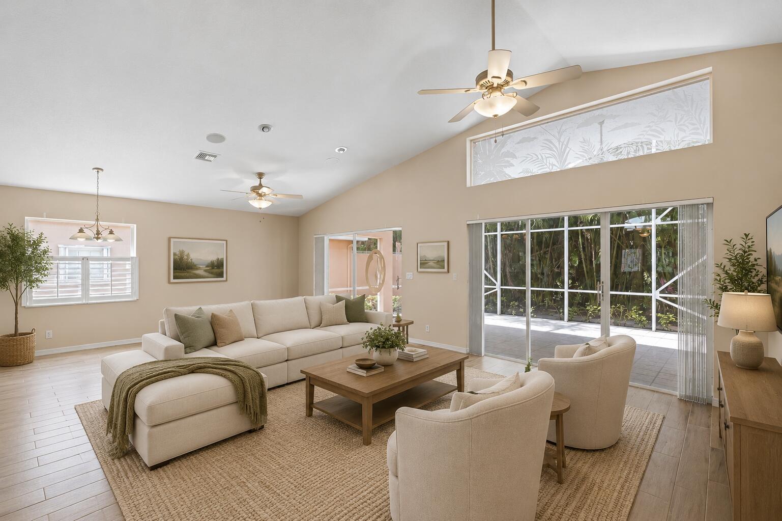 A living room features a vaulted ceiling, a sectional sofa, two armchairs, and sliding glass doors — 7818 Caprio Drive, Boynton Beach FL 33472, BOYNTON BEACH, FL