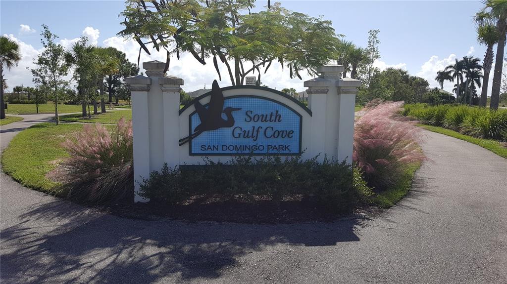 A sign for South Gulf Cove San Domingo Park stands between two paved paths — 10022 CALUMET BOULEVARD, PORT CHARLOTTE, FL