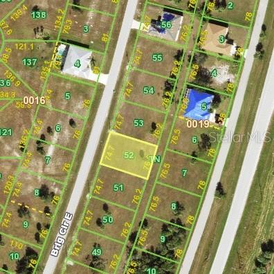 This is a satellite map view showing a vacant, rectangular residential lot highlighted in yellow — 15 BRIG CIRCLE, PLACIDA, FL