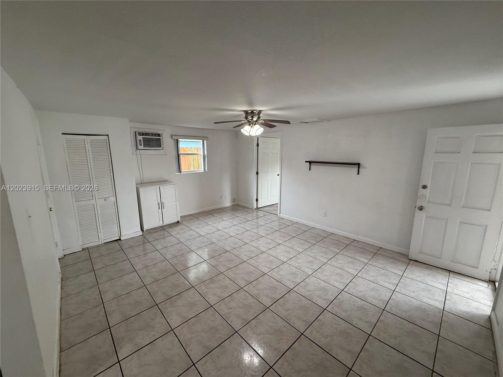 A room with white walls, tiled floors, a ceiling fan, and a window air conditioner — 3513 SW 4th St # 2, Miami FL 33135, MIAMI, FL