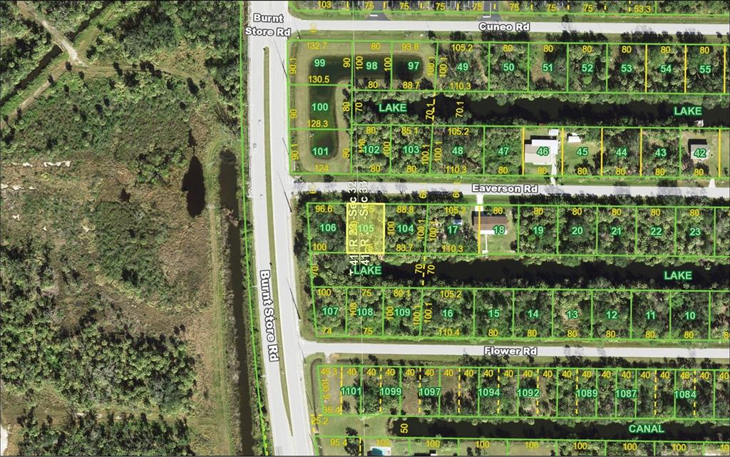 This is a satellite map showing residential lots, streets, and bodies of water — 26003 EAVERSON ROAD, PUNTA GORDA, FL