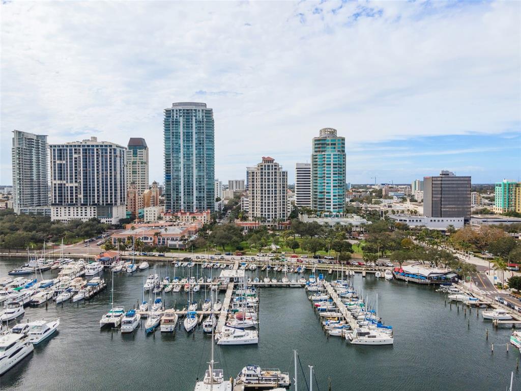 An aerial view of a marina with numerous boats docked in front of a city skyline — 100 BEACH DRIVE NE UNIT 1501, ST PETERSBURG, FL