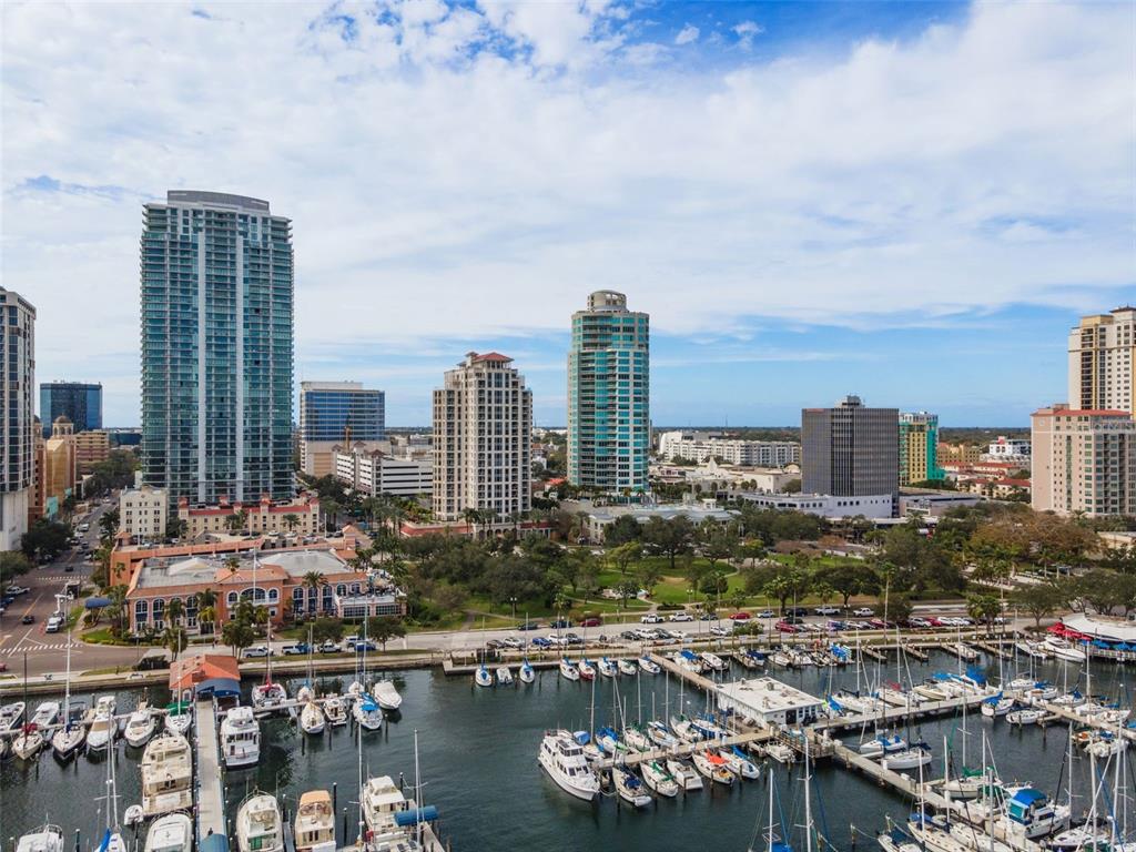 An aerial view of a marina with sailboats in front of a city skyline — 100 BEACH DRIVE NE UNIT 1501, ST PETERSBURG, FL