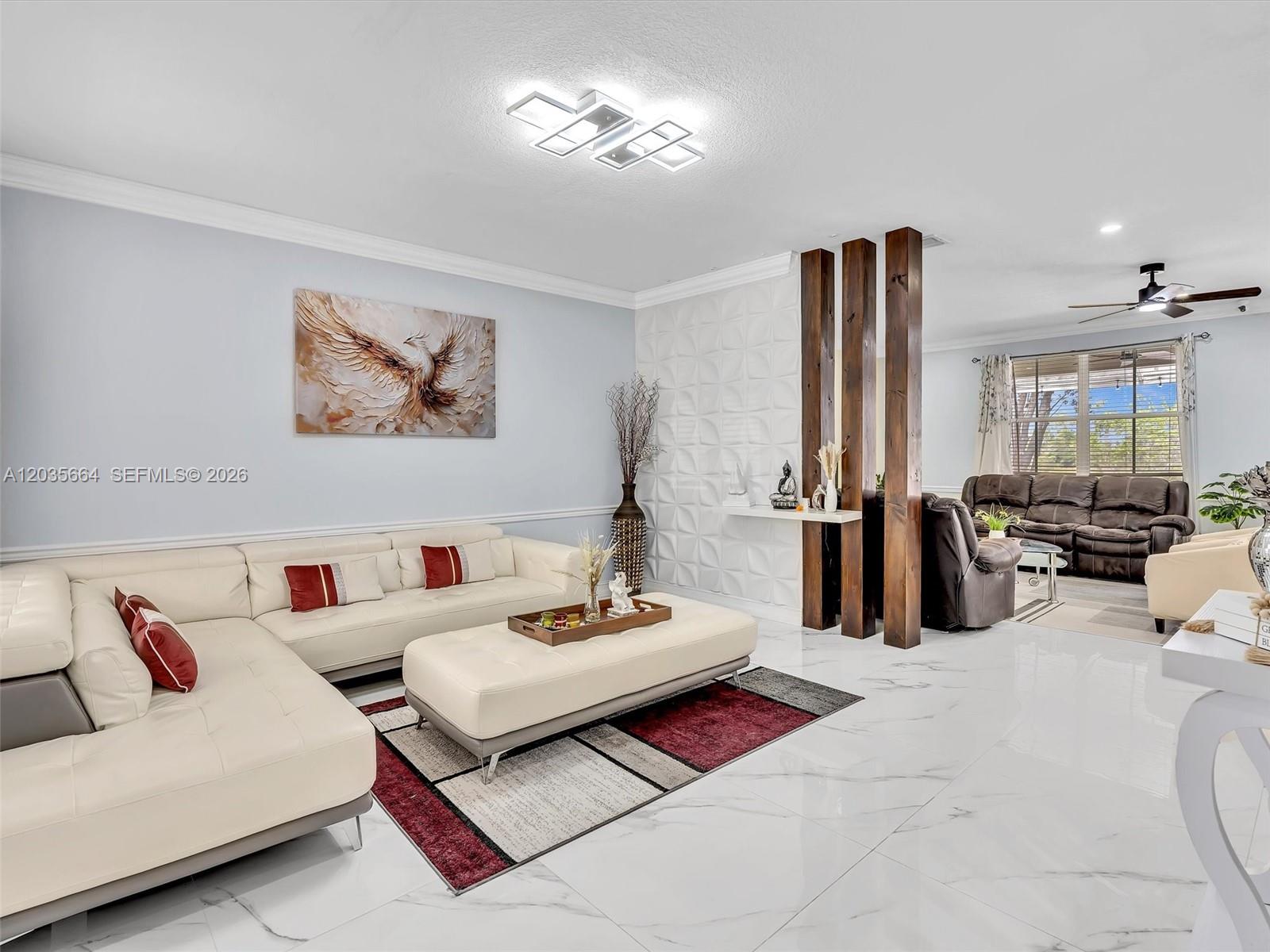 A living room features white tile floors, a cream sectional, and decorative wooden room dividers — 1581 Winterberry Ln, Weston FL 33327, WESTON, FL
