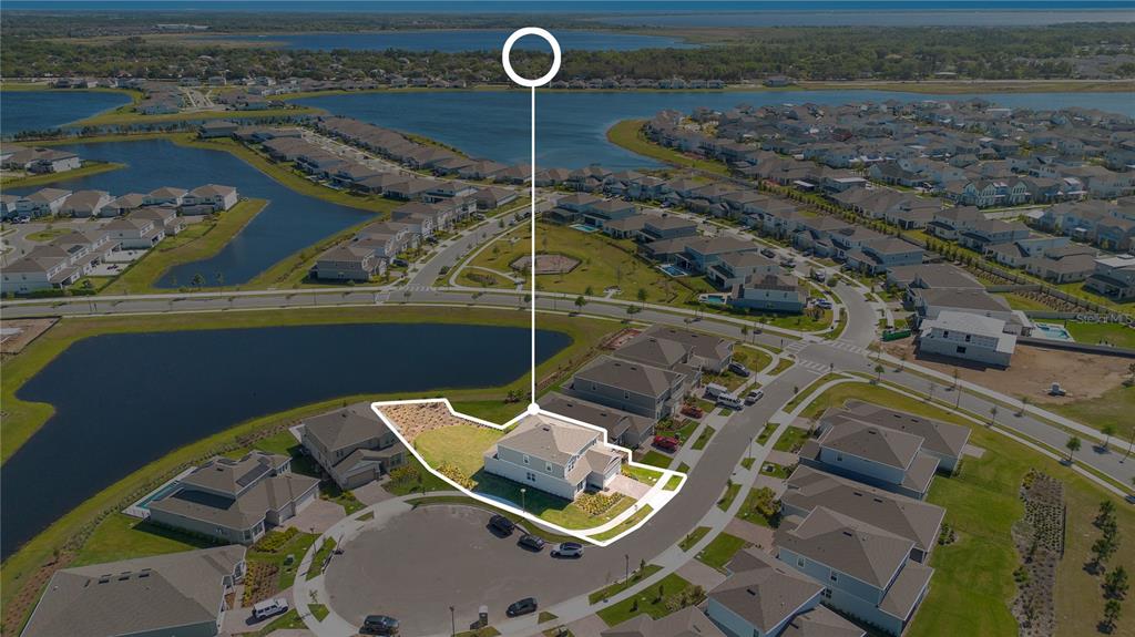 An aerial view shows a two-story house with a large corner lot and backyard — 13231 PANAMA BEACH COURT, ORLANDO, FL