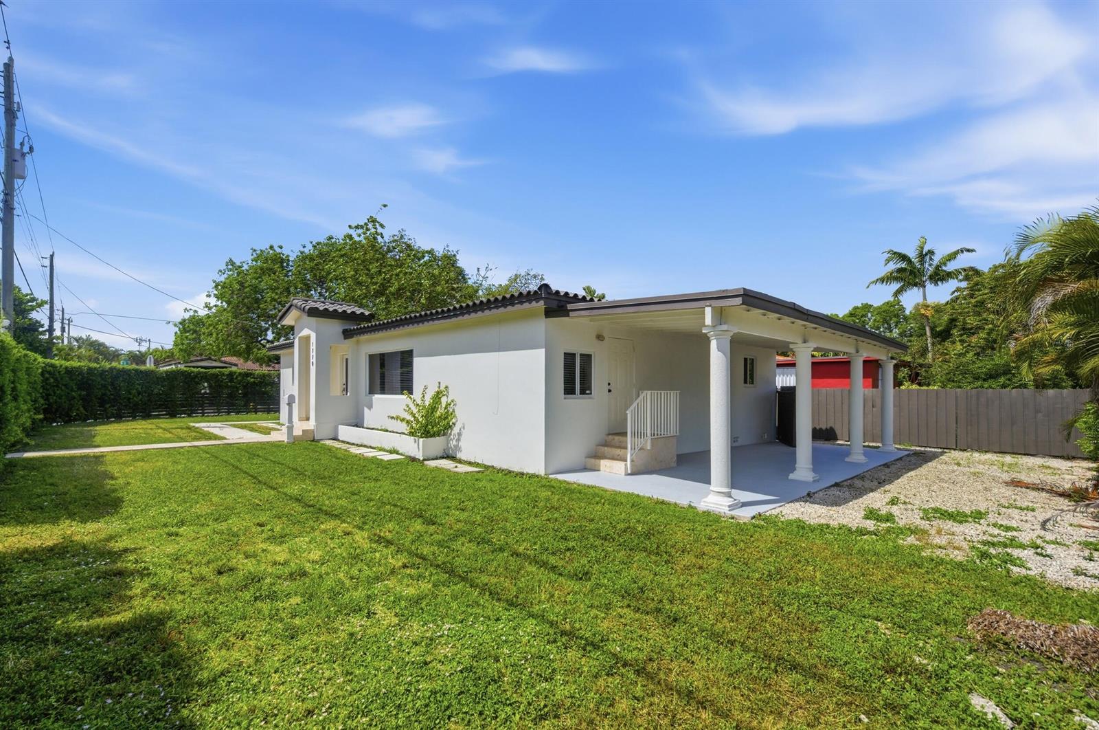 A white single-story house with a covered porch, columns, and a grassy front yard — 1770 SW 17th Avenue, Miami FL 33145, MIAMI, FL