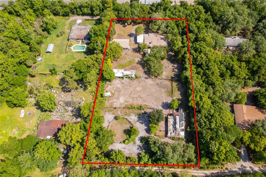 An aerial view shows a large, rectangular residential lot outlined in red with multiple structures — 1281 NATURES WAY, WINTER SPRINGS, FL