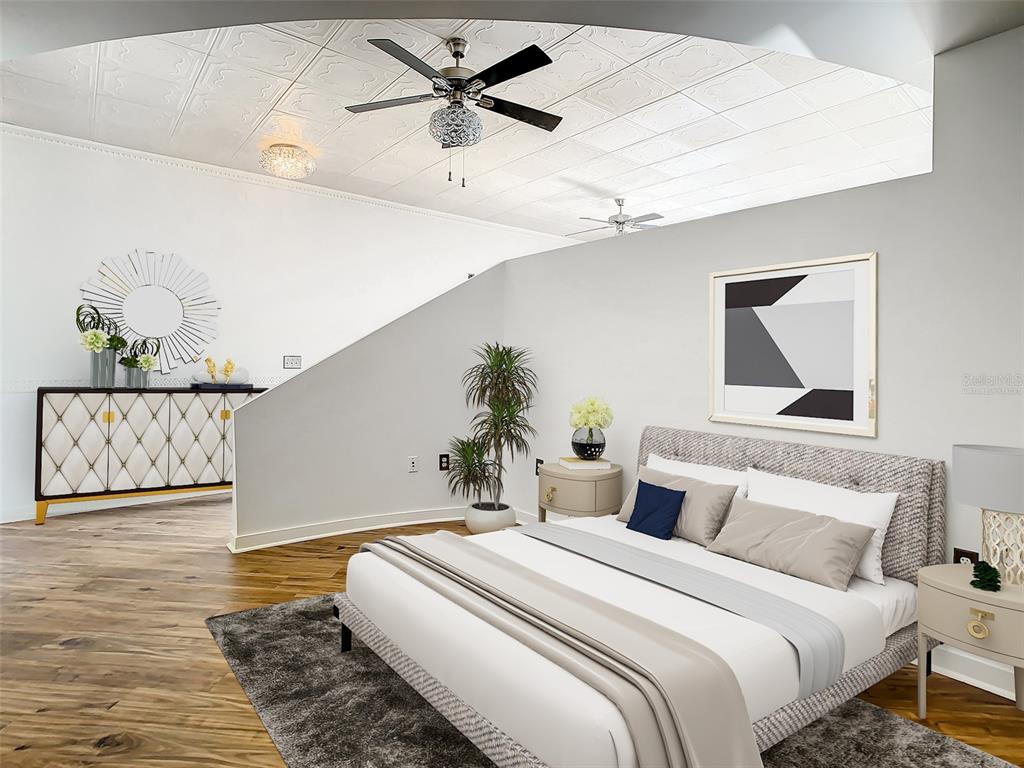 A bedroom features a patterned ceiling, a bed with gray bedding, and a partial wall — 155 S COURT AVENUE UNIT 2107, ORLANDO, FL