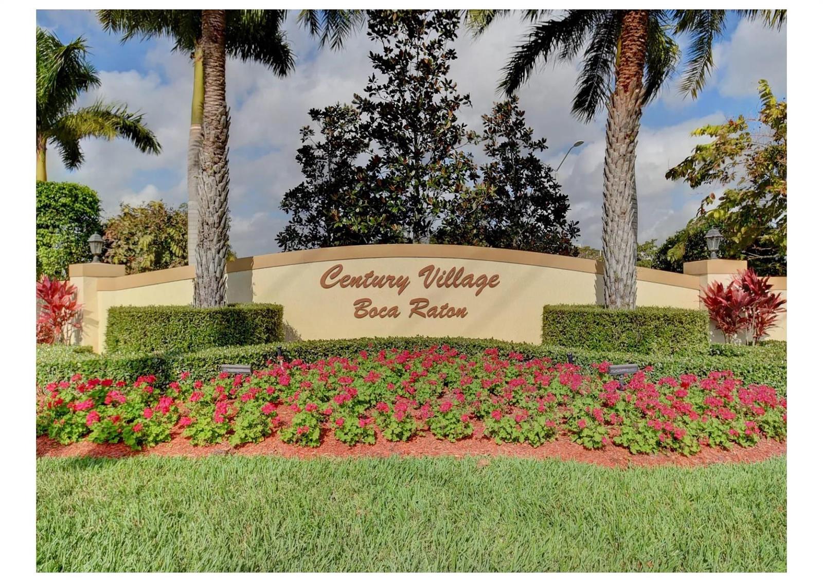 A sign for Century Village in Boca Raton stands behind a bed of red flowers — 251 Preston F # 251, Boca Raton FL 33434, BOCA RATON, FL