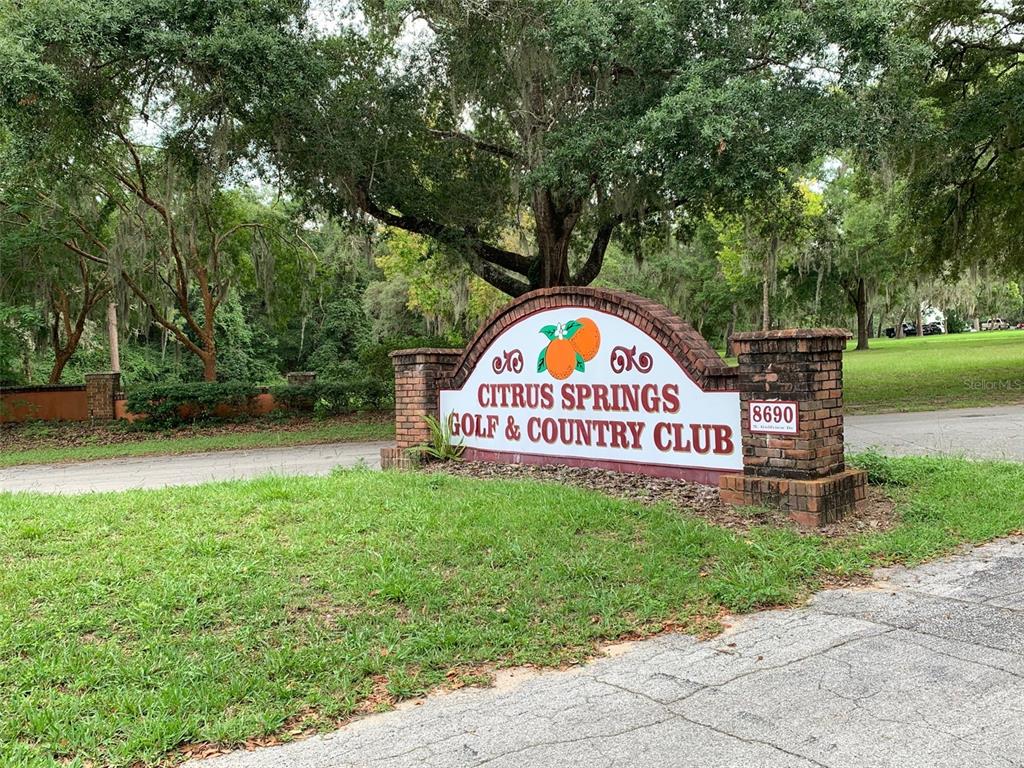 A brick monument sign for the Citrus Springs Golf and Country Club stands outdoors — 8178 N FEATHER AVENUE, DUNNELLON, FL