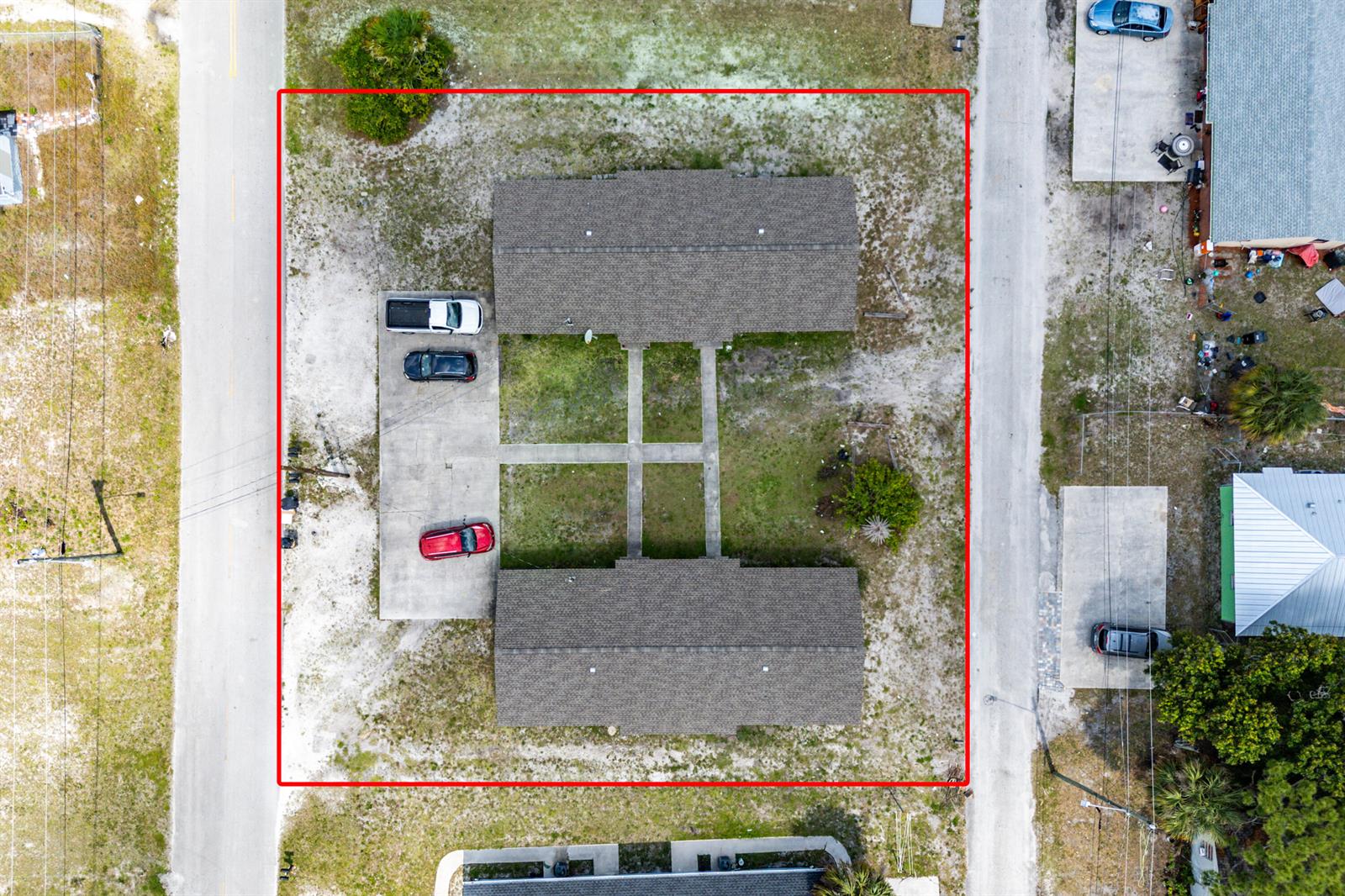 An aerial view shows a rectangular property lot containing two parallel buildings and parking spaces — 1205 Ave K, Fort Pierce FL 34950, FORT PIERCE, FL