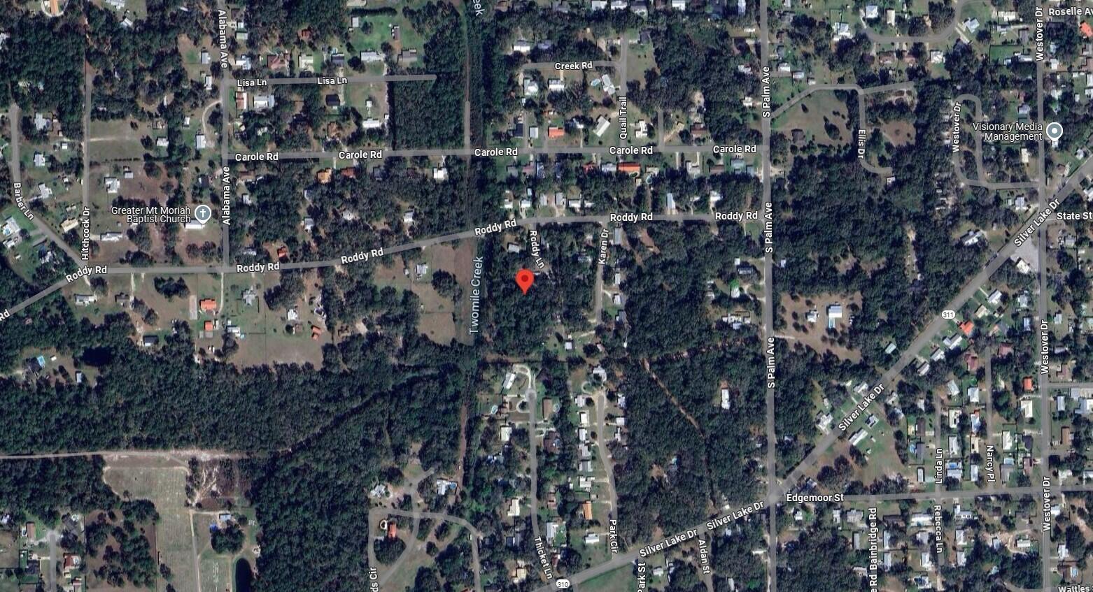 This is an aerial map view of a residential area with streets and wooded lots — 115 Roddy Lane, Palatka FL 32177, PALATKA, FL