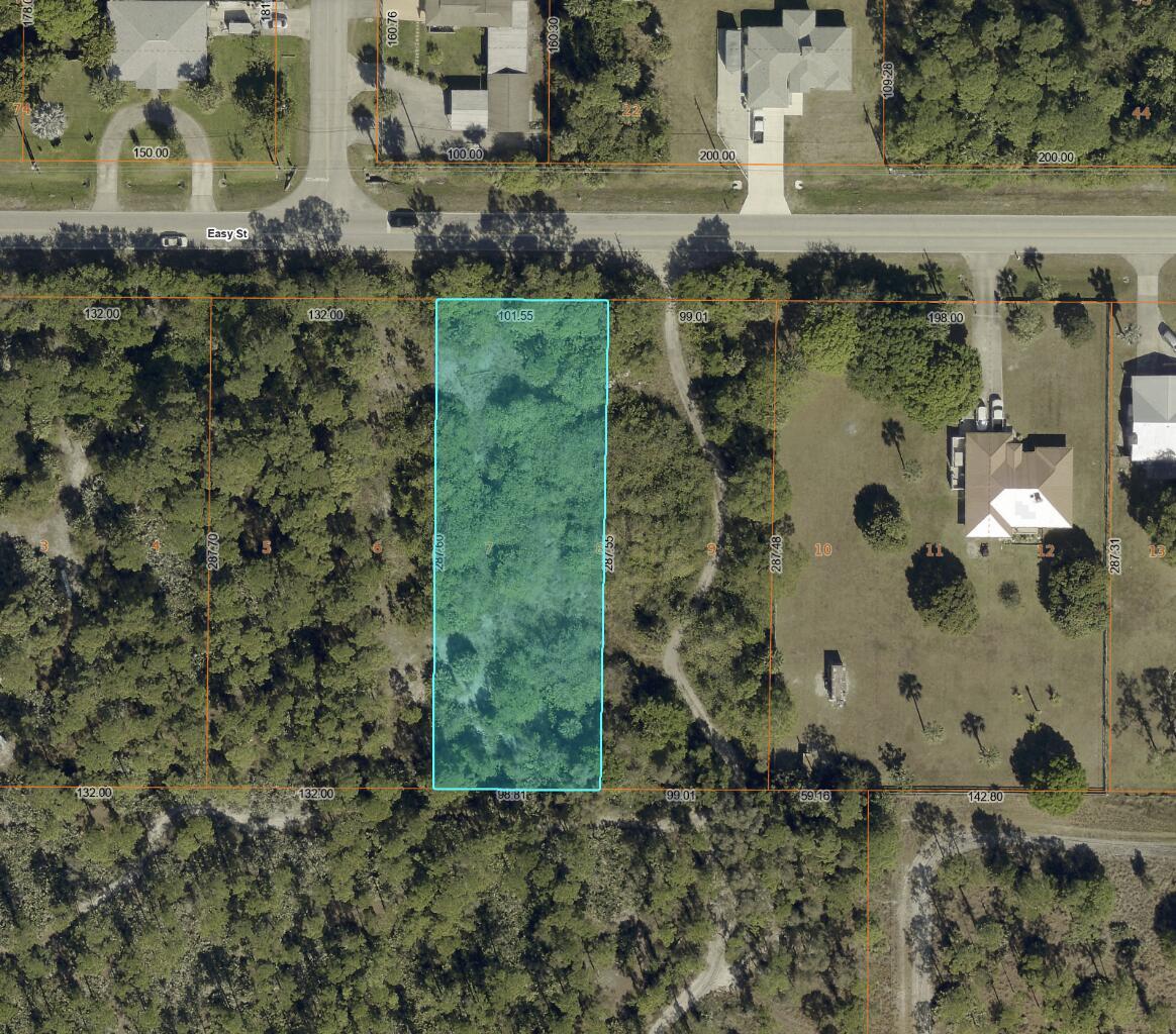 This is an aerial map showing a rectangular, wooded parcel of land highlighted in blue — (0001) E Easy Street, Fort Pierce FL 34982, FORT PIERCE, FL