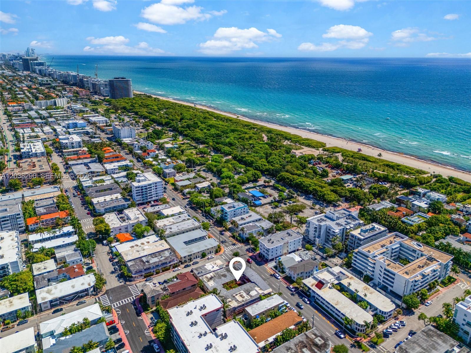 An aerial view shows a coastal city with a marked building near the beach — 7840 Harding Ave # 3, Miami Beach FL 33141, MIAMI BEACH, FL