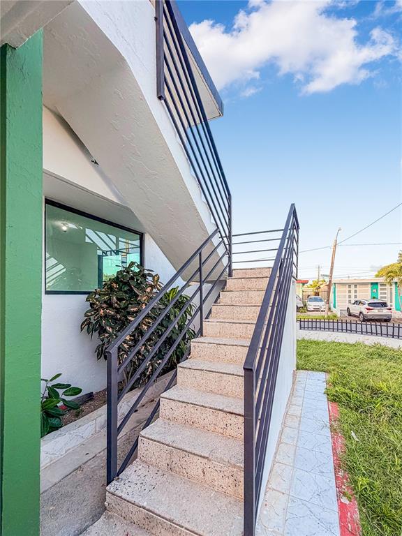 An exterior view of a concrete staircase with black metal railings leading to an upper level — 234 234 UNIT HH16 - B, CAROLINA, PR