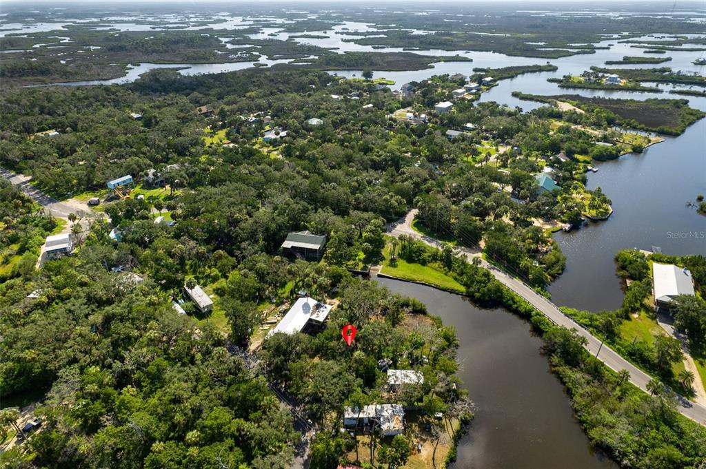 An aerial view shows a wooded residential area with a house marked by a red pin — 14512 W BLACK CREEK DRIVE, CRYSTAL RIVER, FL