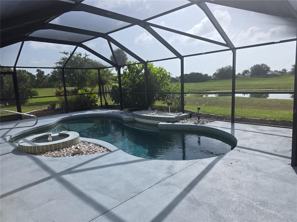 A single-story house with a yellow exterior, a brown roof, and a large front lawn — 20 MEDALIST COURT, ROTONDA WEST, FL