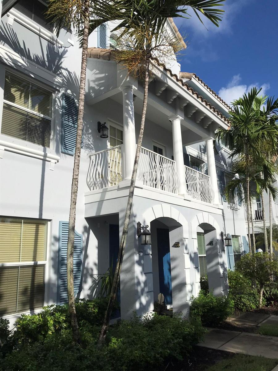 A three-story building exterior features a white balcony with columns and blue shutters — 1430 Via Alferi, Boynton Beach FL 33426, BOYNTON BEACH, FL