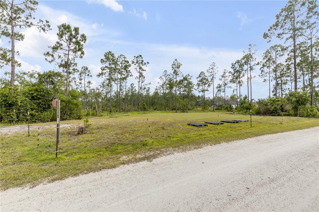 This is a floor plan showing a one-bedroom apartment layout with an attached garage — 300 OMEGA RANCH ROAD, NEW SMYRNA BEACH, FL